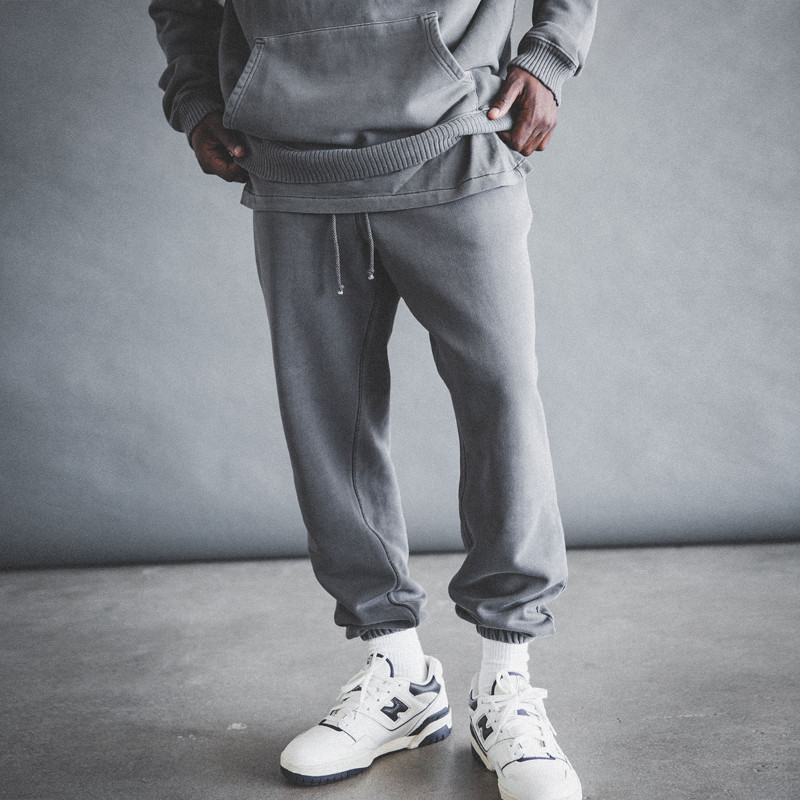 Model-Wearing-Elwood-Core-Sweatpants-and-trainers